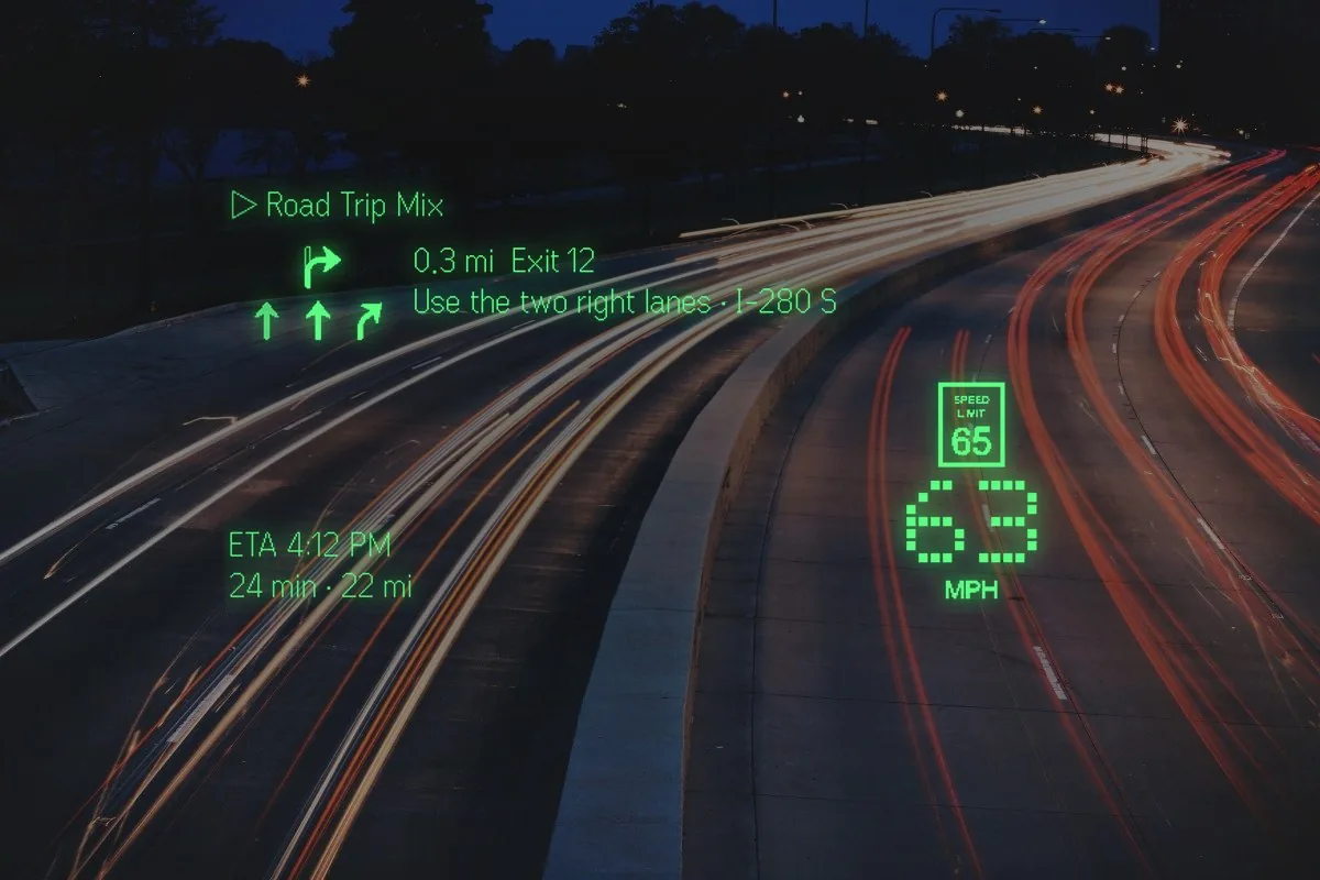 A night highway through the glasses: Exit 12 is 0.3 mi out and the lens says use the two right lanes for I-280 S, with lane arrows, the posted 65 beside your 63 mph, and ETA 4:12 PM, 24 min, 22 mi in the corners. The middle of the lens is clear road.